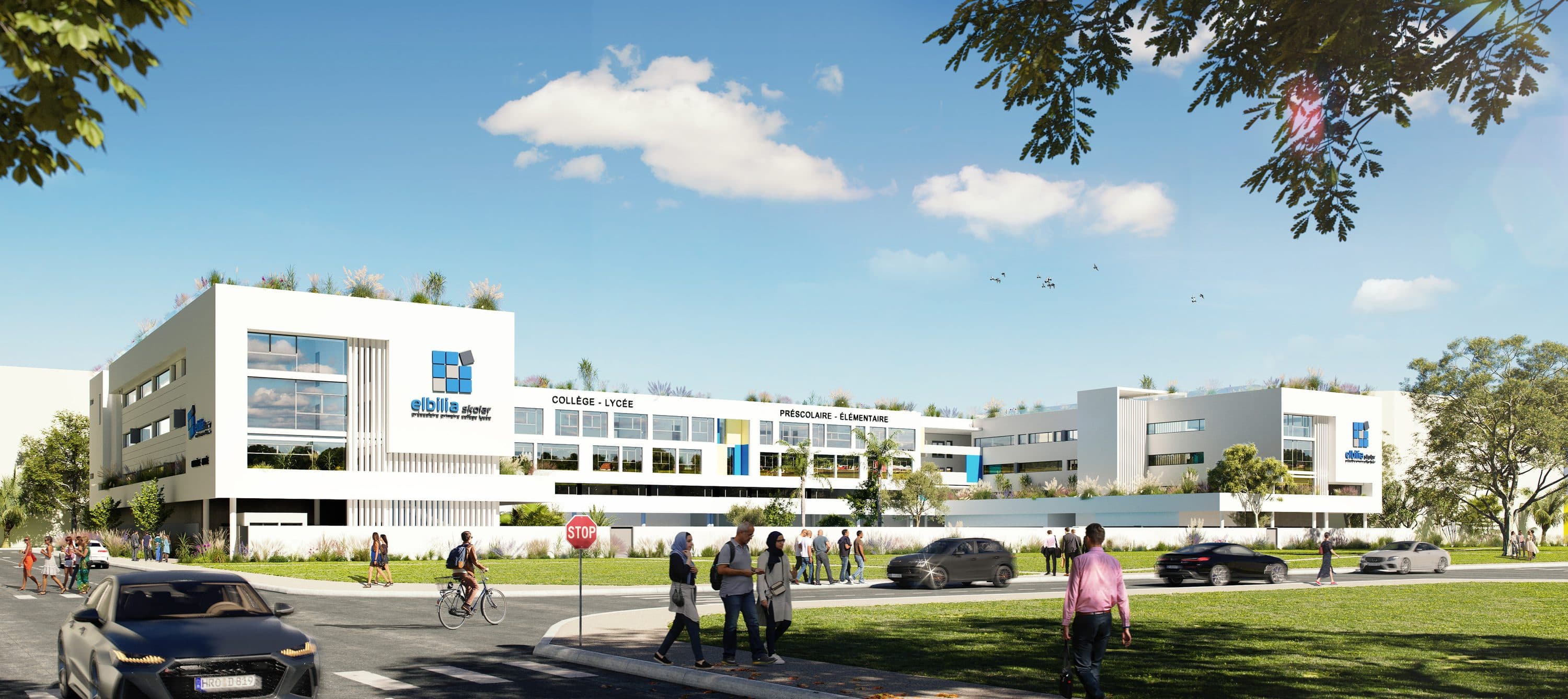 L’école depuis la rue, une longue façade blanche